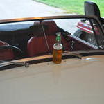 With a bottle of beer to celebrate